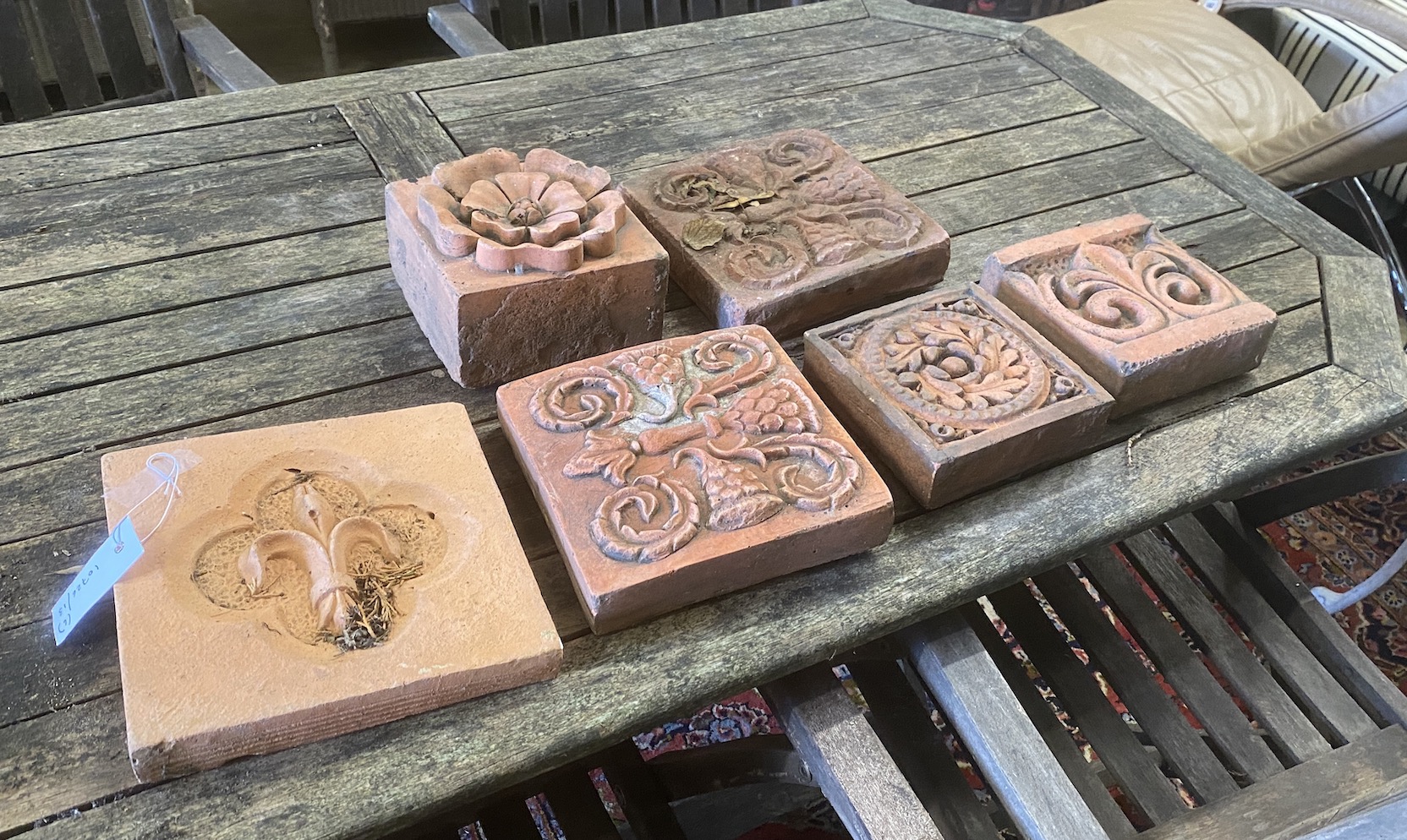 Six terracotta tiles / bricks, largest 2 x 22cm